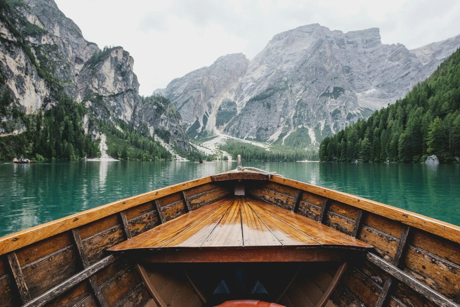 A cinematic alpine lake surrounded by dramatic mountains